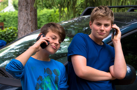 Guys on the phoneの写真素材