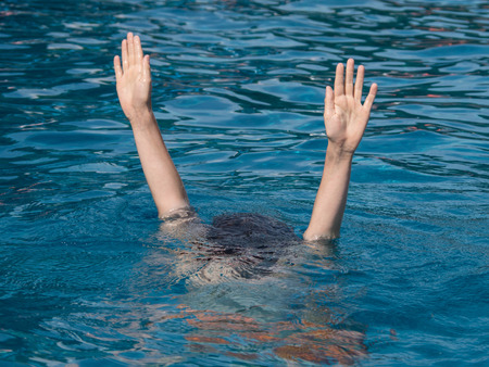 boy diving in the poolの写真素材