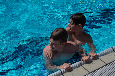 brothers in the poolの写真素材
