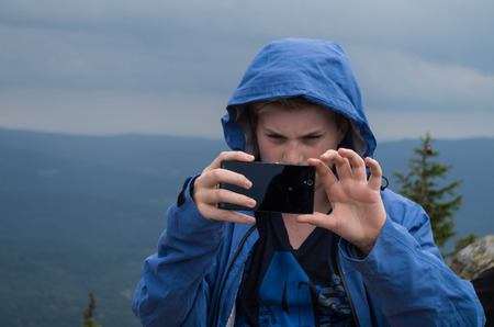 Boy when photographing in the mountainsの写真素材