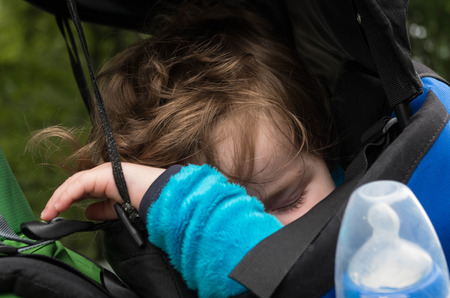 Little kid while sleeping in the Rckentrageの写真素材