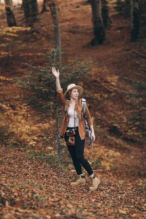 Close up Attractive young woman in stylish hat looking aroundの写真素材