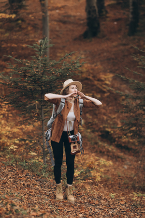 young traveler girl in a nice outfit with a backpackの写真素材