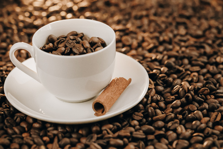 Coffee cup and saucer on a wooden tableの写真素材