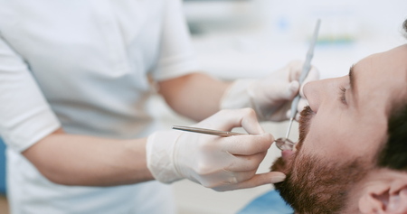 Attractive man in a the dental chairの写真素材