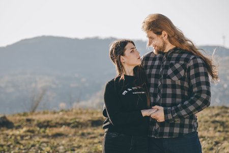 Close up portrait of attractive young couple outdoors. Attractive young couple in love