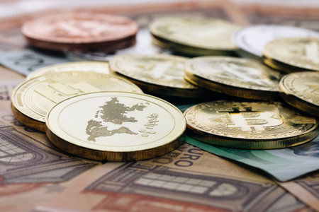 Bitcoins on euro banknotes. Bitcoin. Cryptocurrency, bitcoin and money. Exchange bitcoin for the...