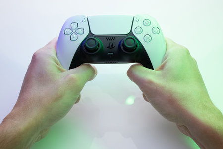Lviv, Ukraine - November 25 2020: PlayStation 5 Sony reveals PS5. Dualsense controller. Man holding...