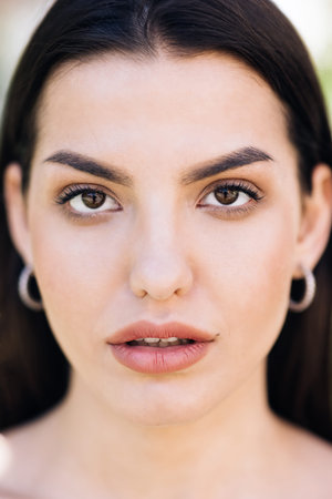 Perfect model with creative vivid makeup and pink lipstick on lips. Beautiful face of tender...