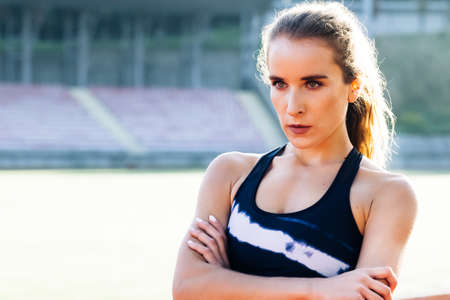 Portrait of fitness woman in sport clothes professional athlete after physical training. Fitness lifestyle portrait, caucasian model, trained body, copyspace.の写真素材