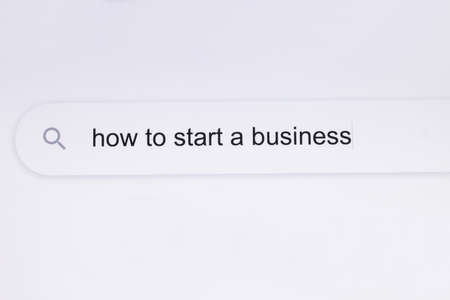 How to start a business - Internet browser search bar typing question. Search for information about how to start a business in the Internet browser. Typing in a search line on the computerの写真素材