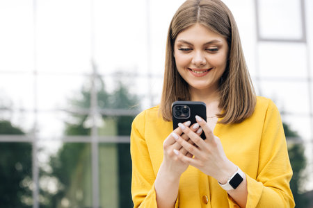 People portraits and technology concept. Appealing young elegant caucasian woman using social media...