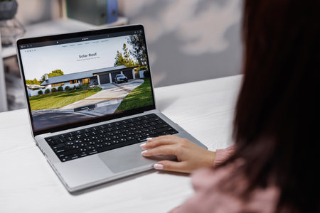 CALIFORNIA, USA - NOVEMBER 14, 2022: Tesla Solar Roof buying online on tesla website. Produce Clean Energy From Roof. Eco friendly house with solar energy panel. Solar cell systemのeditorial素材
