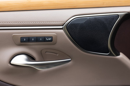 Buttons for adjusting seat position with memory. Car automatic seat memory control buttons close-up. Memory seat technology inside luxury vehicle car.の写真素材
