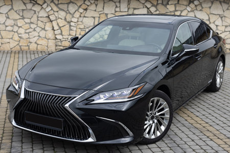 Black hybrid sedan car standing in a road. Fleet of generic modern cars. Transportation. Luxury car fleet. Luxury hybrid black carの写真素材