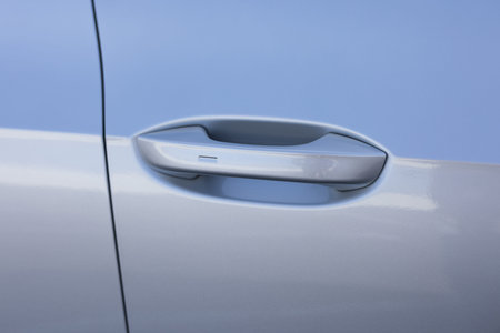 Automatic opening of a car door without a key. Keyless entry car door handle with keyless go touch sensor. Car door handle. Access button. Exterior design of a new electric luxury carの写真素材