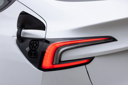 Lviv, Ukraine - March 23, 2024: New Tesla Model 3 highland Type 2 CCS plug port on electric vehicle. Fast charging socket type 2 combo electric car. Eco friendly alternative energyのeditorial素材