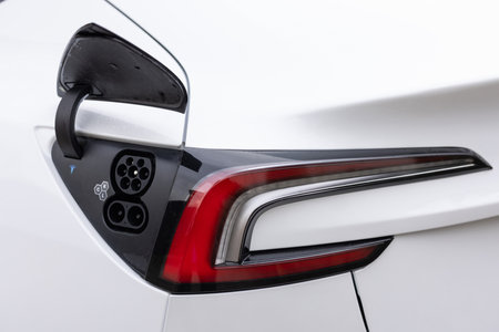 Lviv, Ukraine - March 23, 2024: New Tesla Model 3 highland Type 2 CCS plug port on electric vehicle. Fast charging socket type 2 combo electric car. Eco friendly alternative energyのeditorial素材