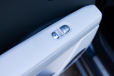 Rear passengers Seat heater button, car interior. Double seat heating switch in a car. Button for heating the rear of seats. Rear seat heated seat controlsの写真素材