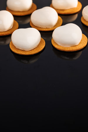 Mousse cakes isolated on black background. Tasty sweet dessert. Ideal for gourmet dessert lovers.の写真素材