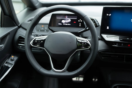 Interior of prestige modern car. Leather comfortable seats, dashboard and steering wheel. Cockpit with exclusive decoration. Modern electric car interior luxuryの写真素材