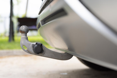 Towbar on a car, black steel part. Tow bar and tow ball on a car. Car detailの写真素材