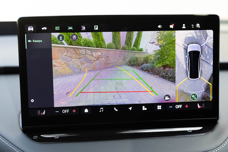 Dashboard display screen with multimedia and 360 camera view in a new luxury vehicle. Front camera...
