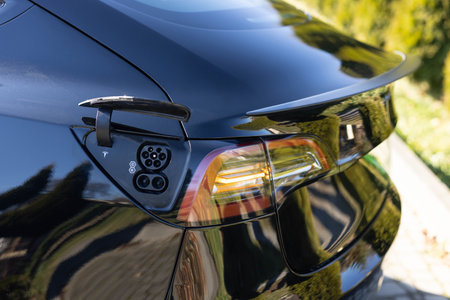 Fast charging socket type 2 combo electric car. DC - CCS type 2 EV charging connector at EV car. Type 2 CCS plug port on electric vehicle. Eco friendly alternative energy green environment concept.の写真素材