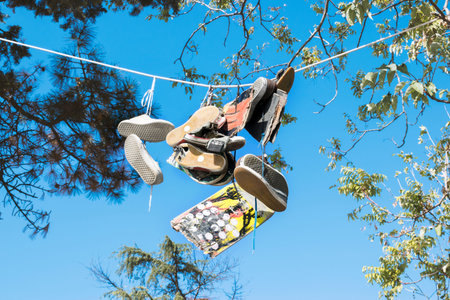 Skateboard and Shoes hanging