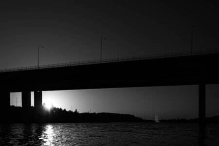sunset, bridge and lake skyline in black and whiteのeditorial素材