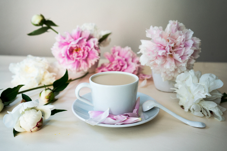 fresh cappuccino in the white cup, still life with peoniesの写真素材