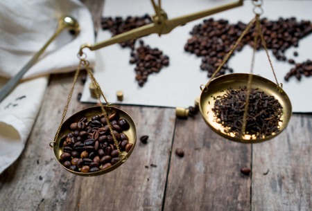 map of the world, lined with coffee beans on old paper.の写真素材