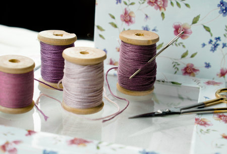 still life. old spool of pink thread.の写真素材