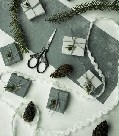 preparation for the holiday - notebook, scissors, thread, silk ribbon, branch of spruceの写真素材