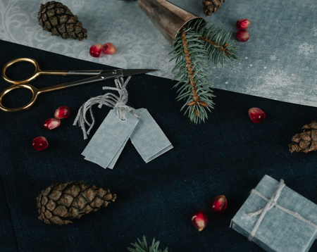 christmas, new year. preparation for the holiday - scissors, thread, silk ribbon, branch of spruceの写真素材