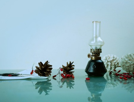 christmas. kerosene lamp with pine cones. space for textの写真素材