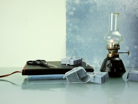 christmas. oil lamp with books. space for textの写真素材