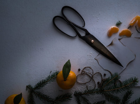 spruce branches, mandarins, ribbons, a letter on the table. space for text. top view