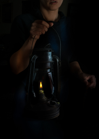 small Dutch style. woman holding a kerosene lamp.の写真素材