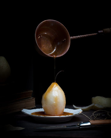 still life. pears and old books on a dark background. vintage.の写真素材