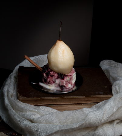 still life. pears and a jug of milk on dark background. old painting.の写真素材