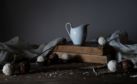 still life, vintage. candy, drapery, a milkman letter on the wooden tableの写真素材