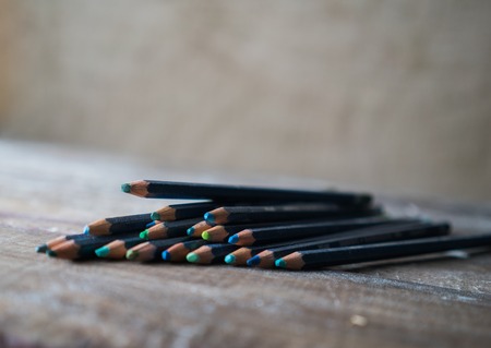 watercolor pencils on the old wooden table. vintageの写真素材