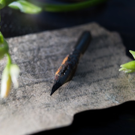 old pen on an vintage paper. close-upの写真素材