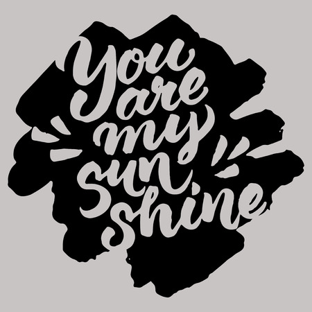 Hand painted quote 'You are my sunshine'. Vector brush lettering on grunge black ink spot.のイラスト素材