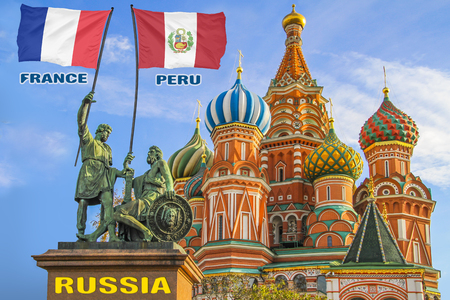 Flags of France and Peru being held by two warriors on a statue in front of a Saint Basil's Cathedral in Moscow, Russiaの写真素材