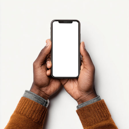 Close up of hands of african american man holding smartphone with isolated screen on white...