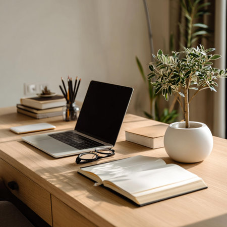 selective focus of laptop with blank screen and stationery on wooden tableの写真素材