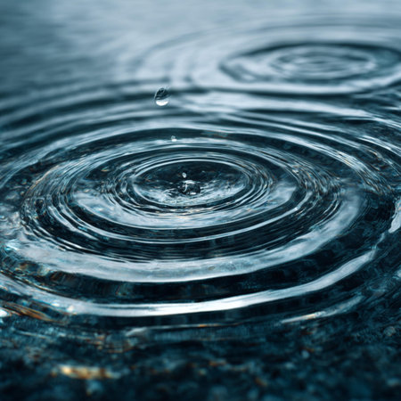 Water drop close up with ripples and ripples. Abstract background
