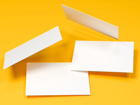 render 3d images of business cards dynamically scattered on a yellow background.